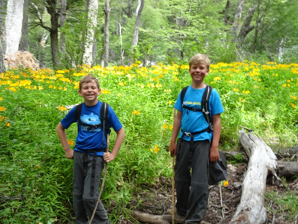Mom don't make us stand by the Flores for a picture on our hike...